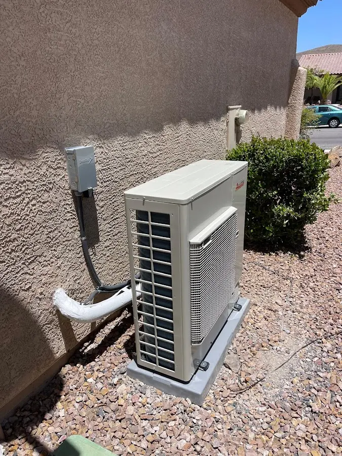 Residential air conditioning condenser unit in McLendon-Chisholm